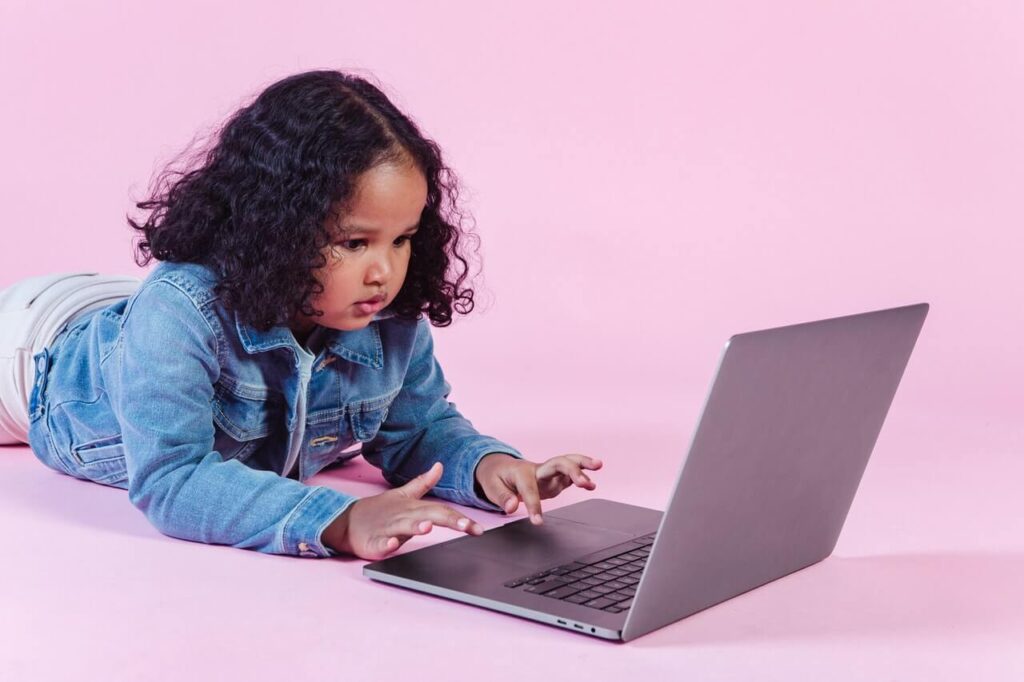Small girl using laptop