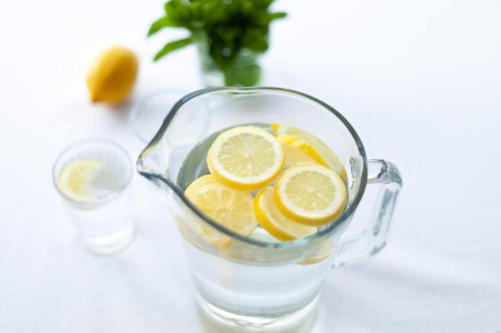 Jar of water with lemon rings floating on top