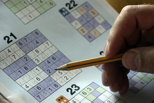 Man solving sudoku