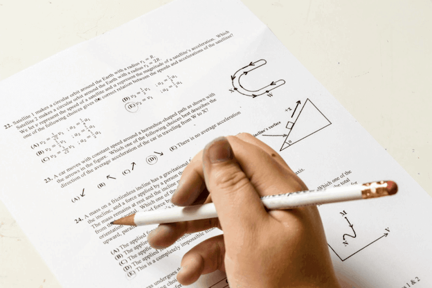 Student reading a math question paper